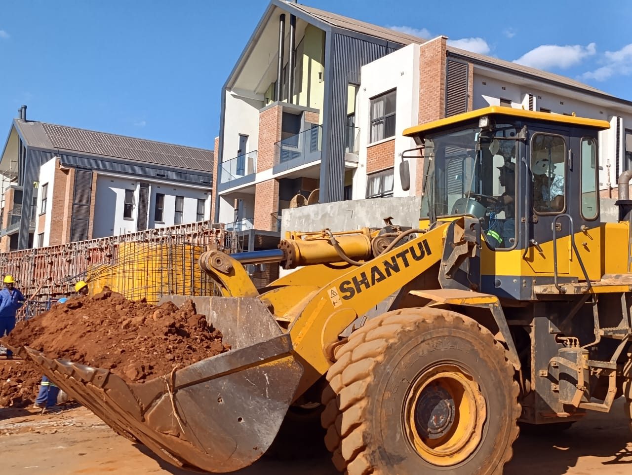 Construction plant at work on a multi-level residential development