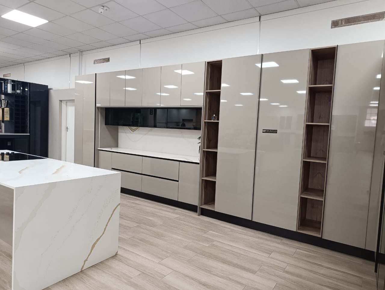 Kitchen cabinetry with marble-finish island unit
