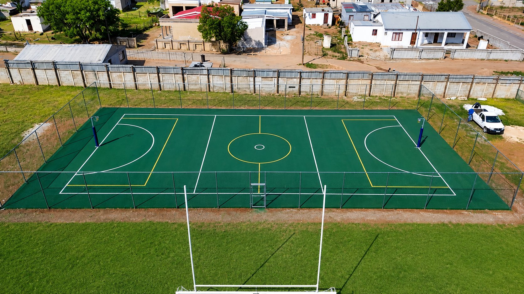 Aerial view of a fenced multi-purpose sports court